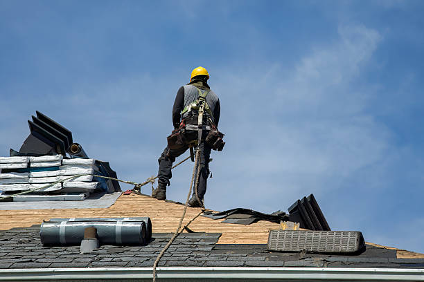 Professional Roof Replacement technician working in Glenwood Landing, NY